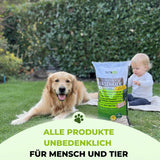Ein Golden Retriever und ein Baby sitzen im Gras neben einer Tüte TerraUno Frühlingsstarter-Set. Text: Alle Produkte unbedenklich für Mensch und Tier-ideal für sichere Rasenpflege mit hochwertigen Rasensamen und Rasendünger.